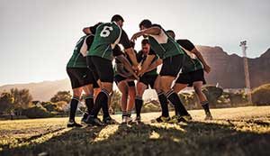 Rugby huddle (Photo: iStock.com/jacoblund)