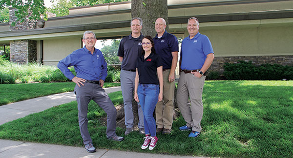 The culture is one of a kind,” says Katherine Miller (pictured center), customer service manager. “(It’s) about the people; they have the heart.” From left to right: Larry Ryan, Roy Heinbach, Miller, Mark Stuhlsatz and Rodney St. John, Ph.D. (Photo: LM Staff)